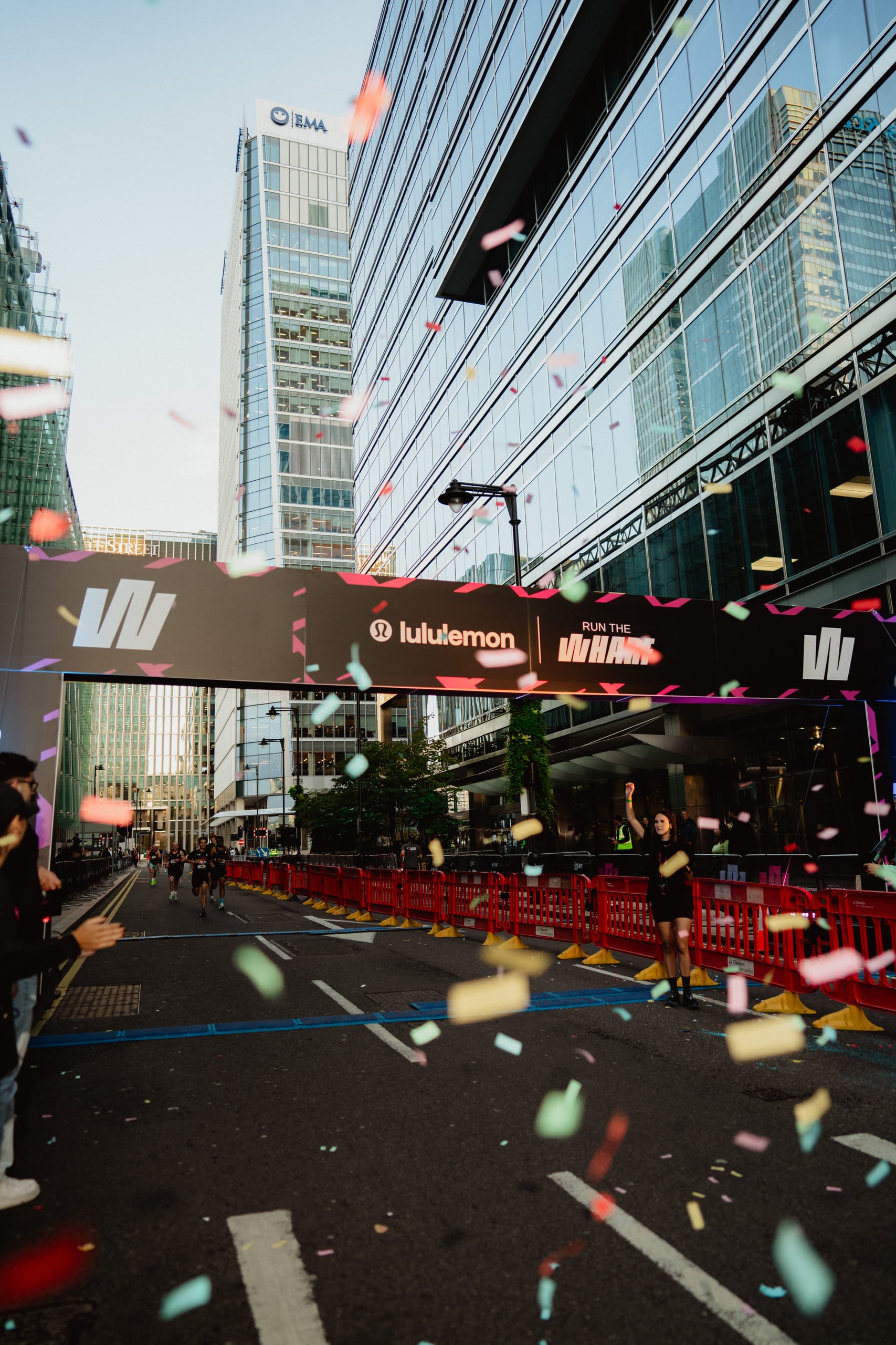 Lululemon Run the Wharf finish gantry with runners and confetti