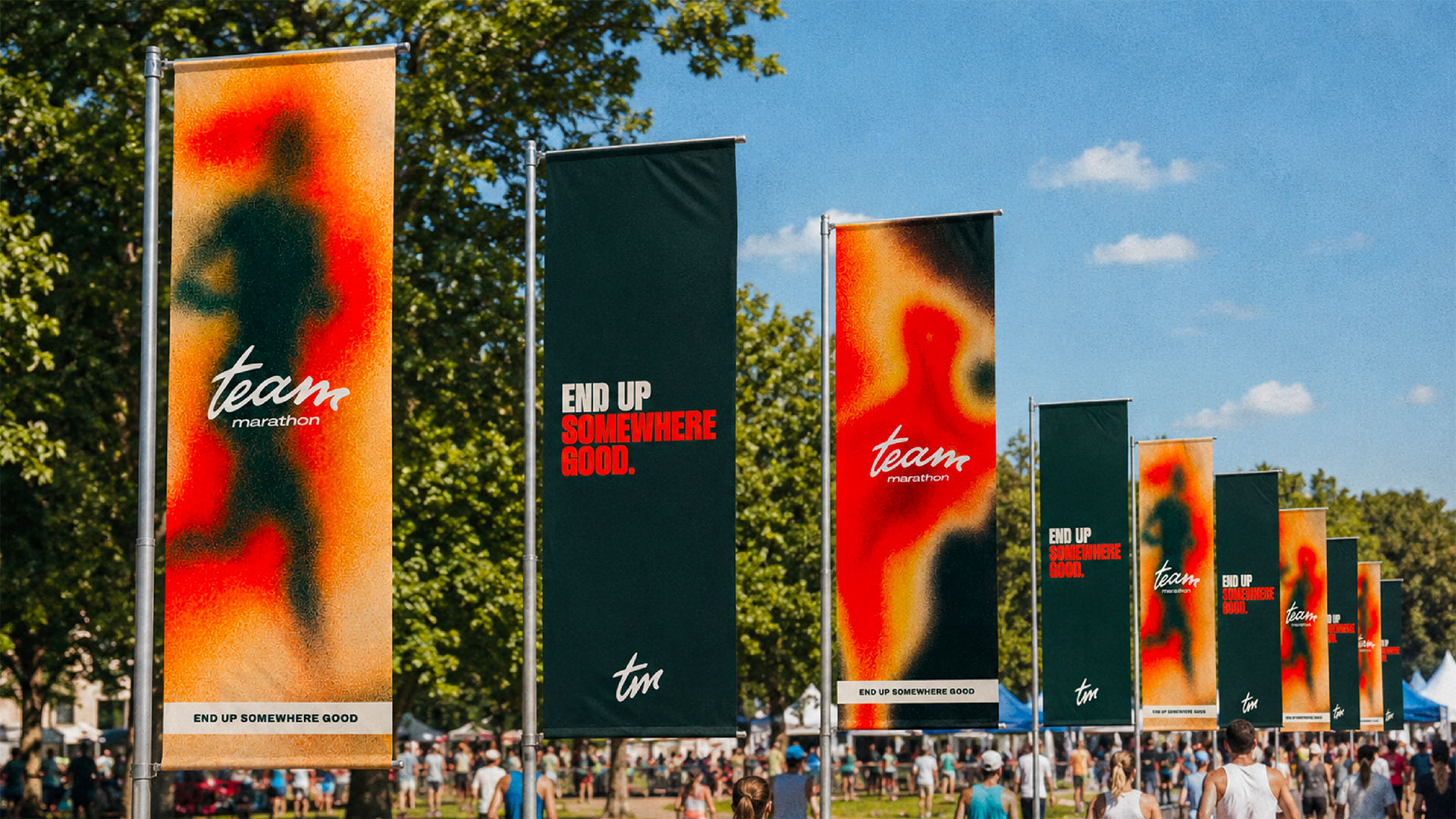 Branded Team Marathon flags guiding participants through an outdoor event